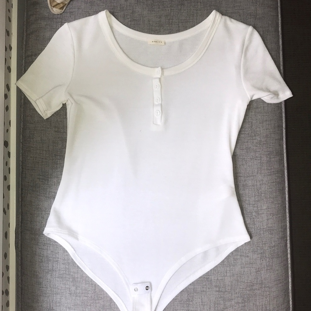 White one piece tee with buttons